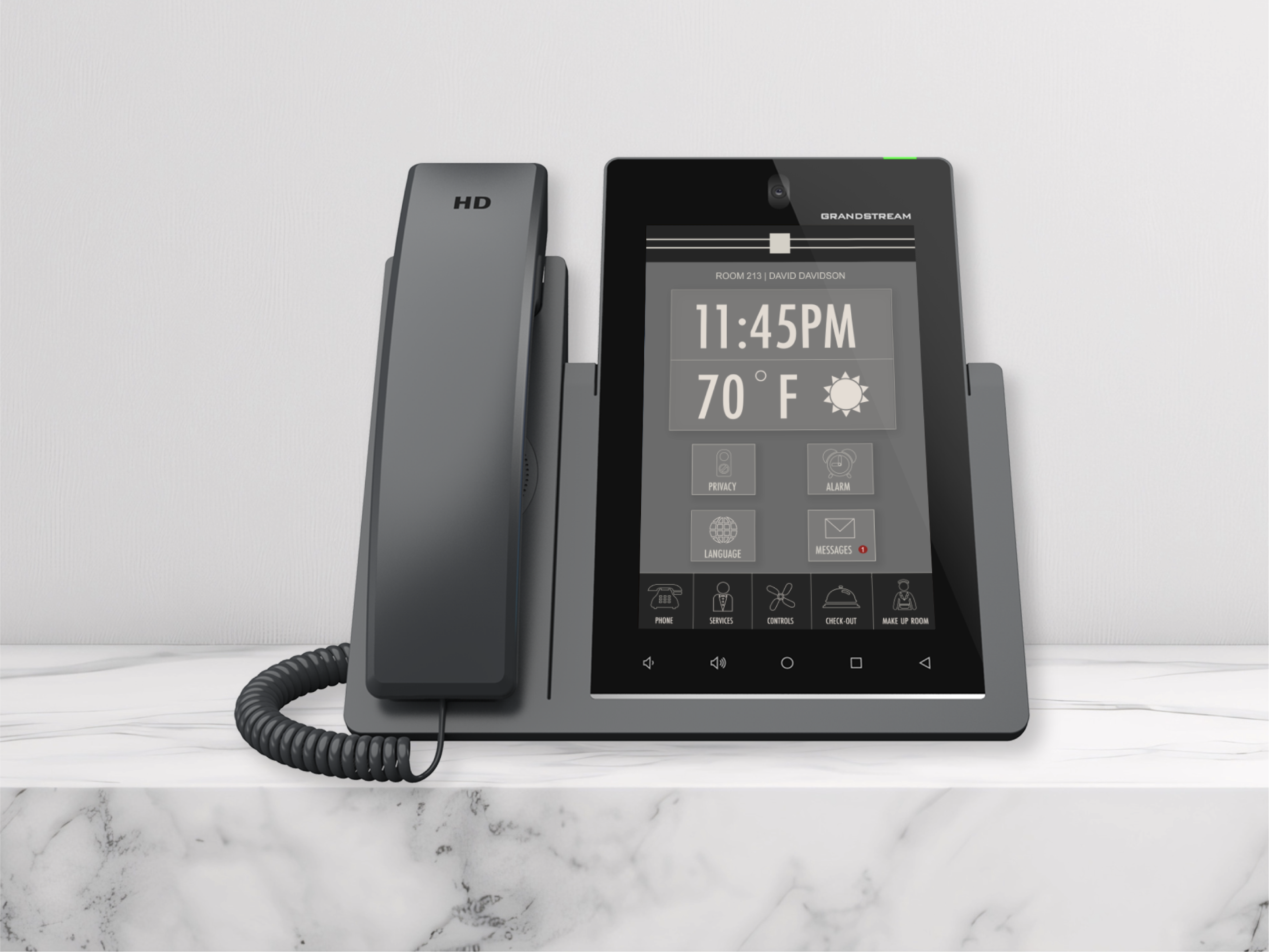 Latitude All-In-One device on a nightstand in a guest room